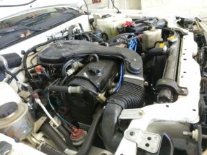 The open hood of a 1989 Toyota Tercel