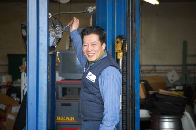 Owner Tony posing for a photo in his shop.
